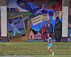 Saturday Dog Days run went by the Hobbs Field mural.