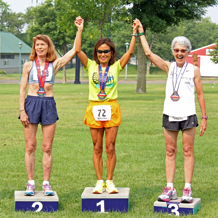 Photo of Dee Boeck (right) on the podium after the 10K National Senior Games 10K.