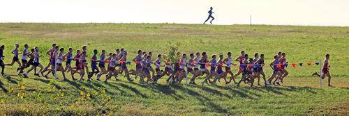 Photo from the Rim Rock Classic men's 8K.  Pack going past John Lawson.