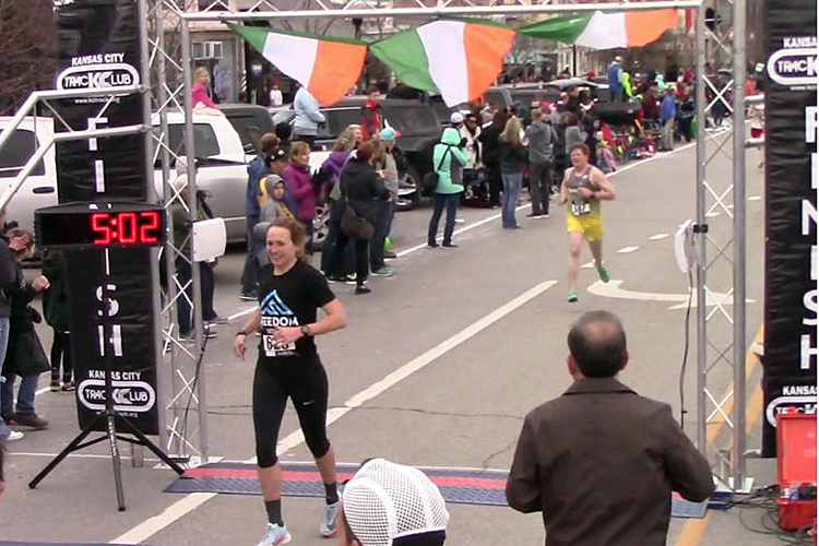 Photo of Rebeka Stowe winning the women's race in the 2018 Irish Mile.