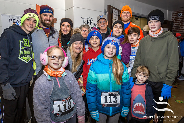 Photo by John Knepper of  a family group photo at the runLawrence Thanksgiving Day 5K.