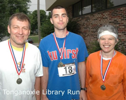 Photo of the Slocums with their medals.