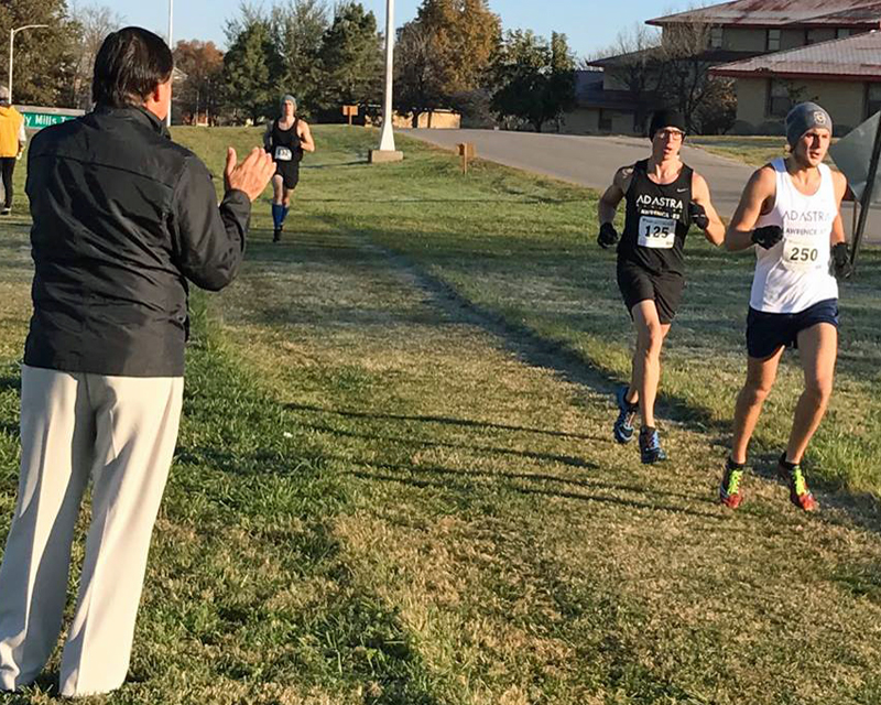 Photo of Billy Mills cheering runenrs at the 2016 Billy Mills 10K on the Haskell campus.