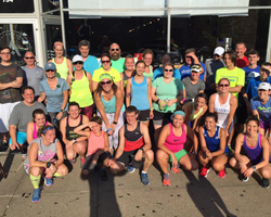 Photo of Mass Street Milers in front of Ad Astra.